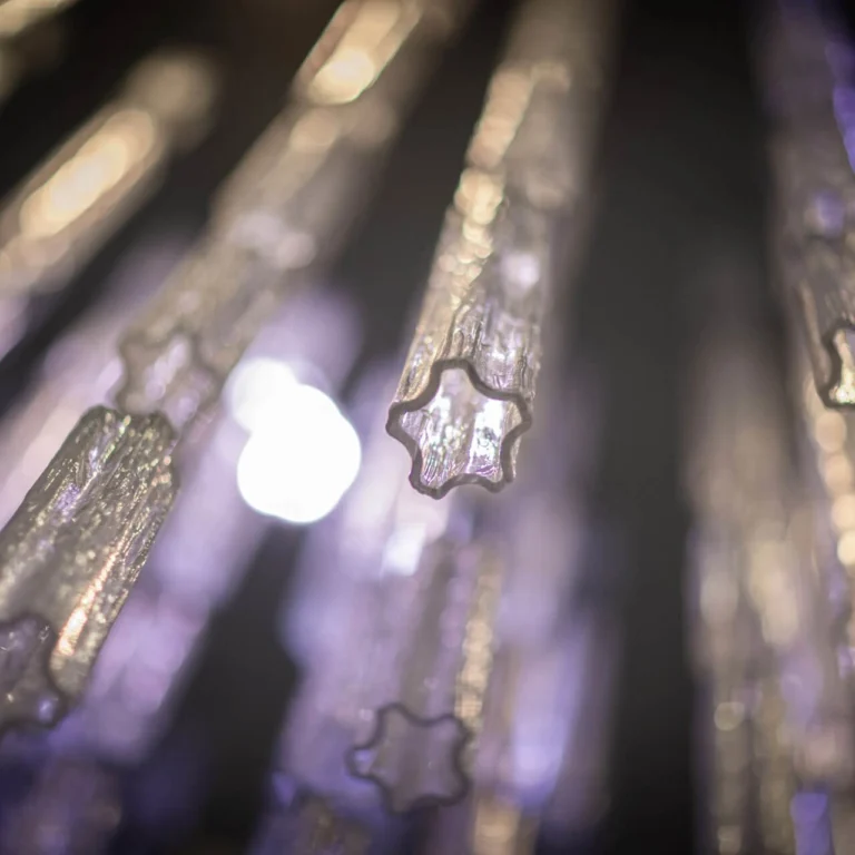 Close-up of the crystal chandelier with hexagonal motif in Hotel Grischa
