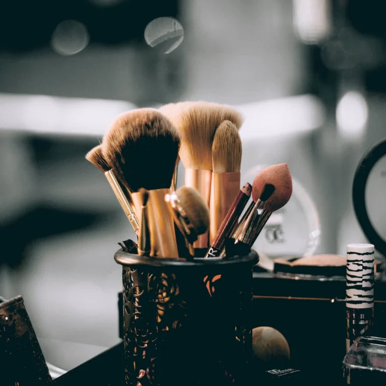 Cosmetic brushes and make-up tools on a table