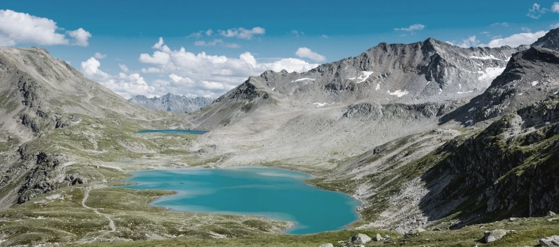 Turquoise blue Jöriseen lakes in the rocky high mountain landscape